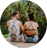 Travel buddies chatting on a rock