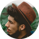 Young bearded man with brown hat