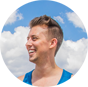 Smiling young guy wearing blue top