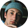 Man wearing light blue stocking cap